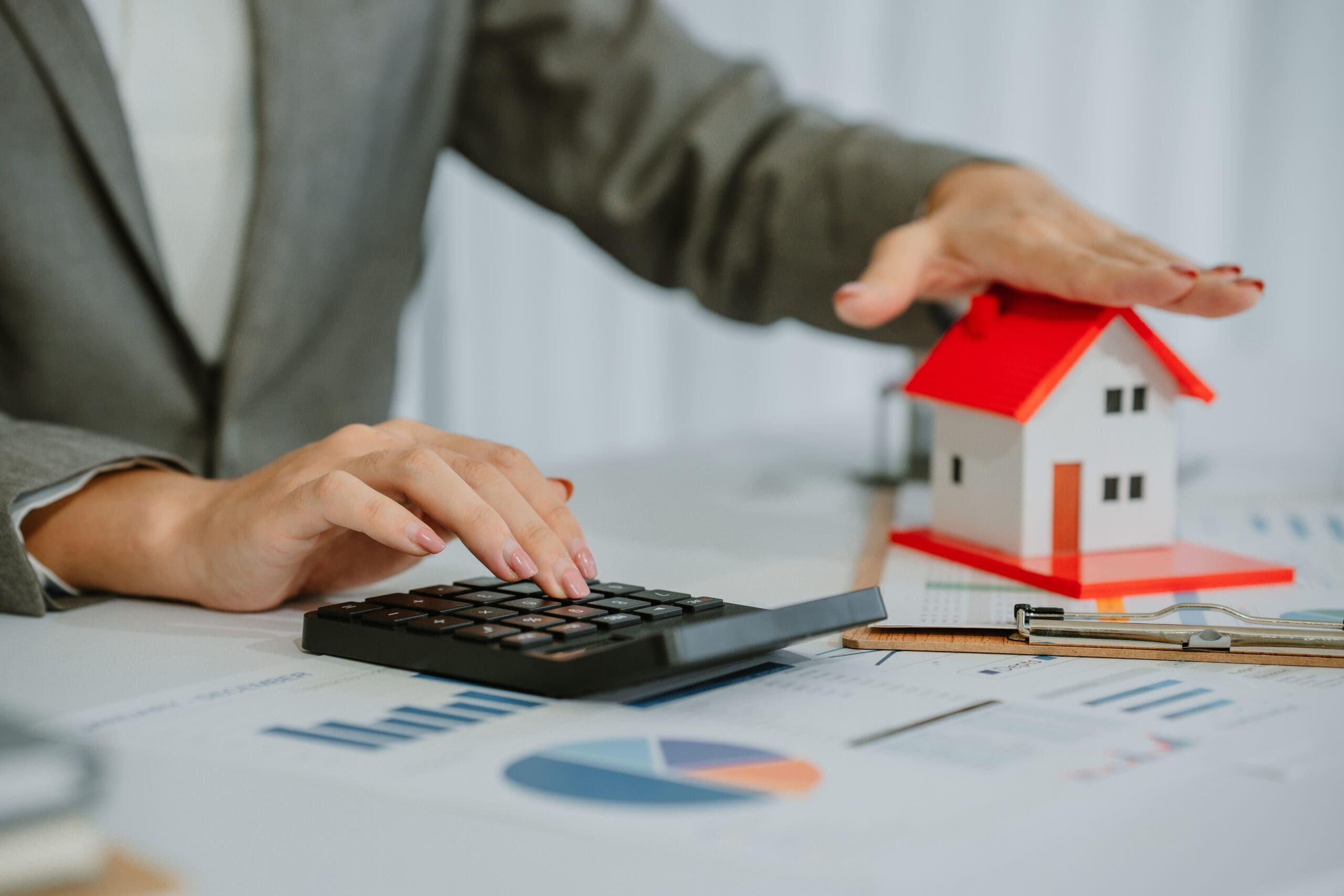 Close-up shot of a real estate agent or realtor meeting with her client, giving new house to her customer.